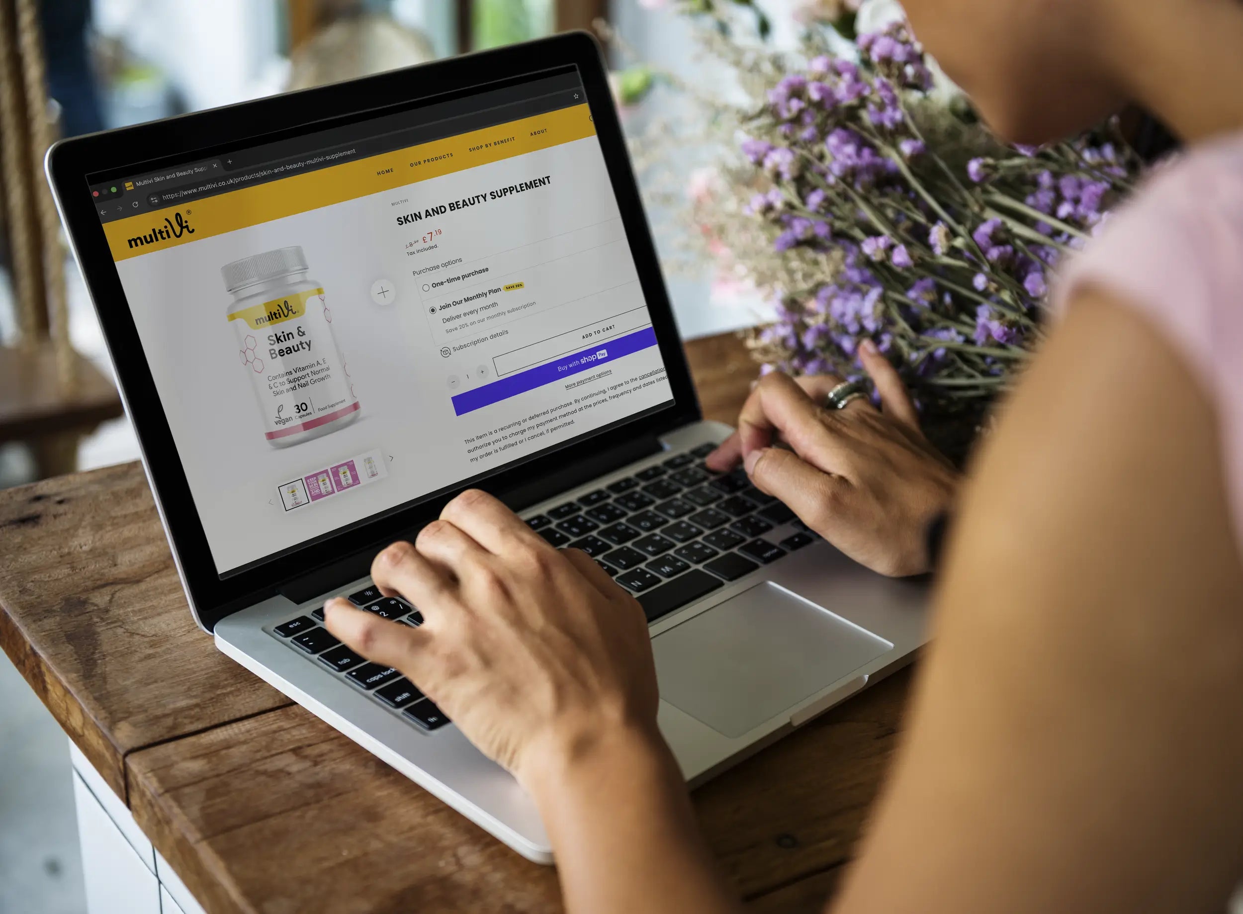 Person browsing products from Multivi's website and selecting purchasing options